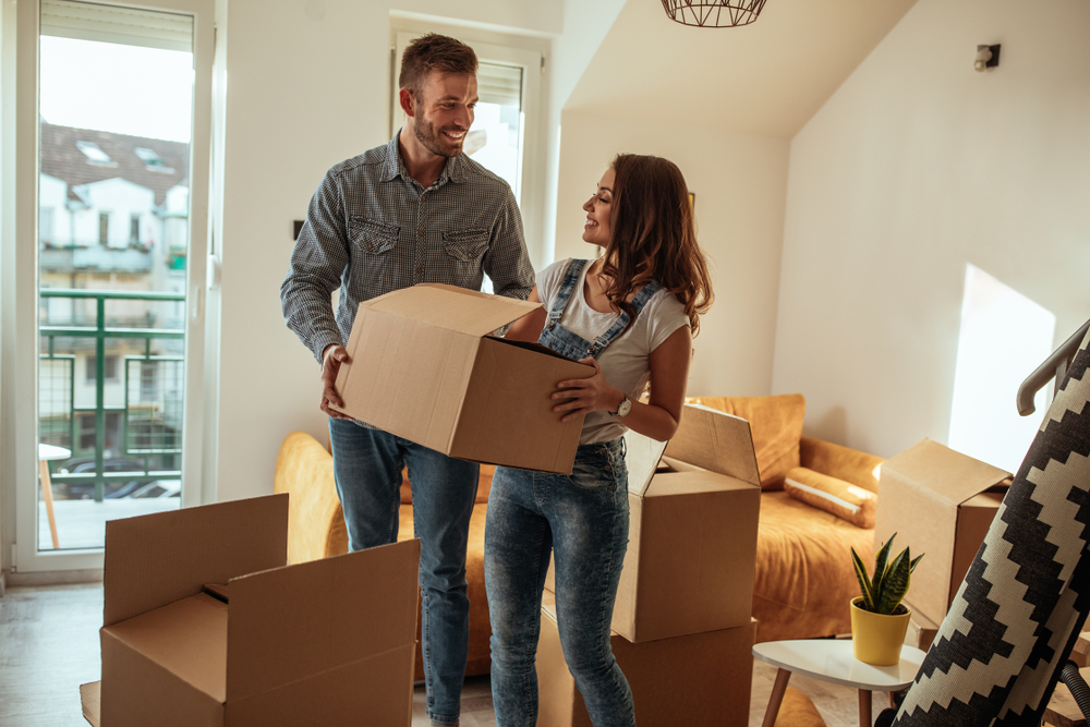 man helping move in with a woman